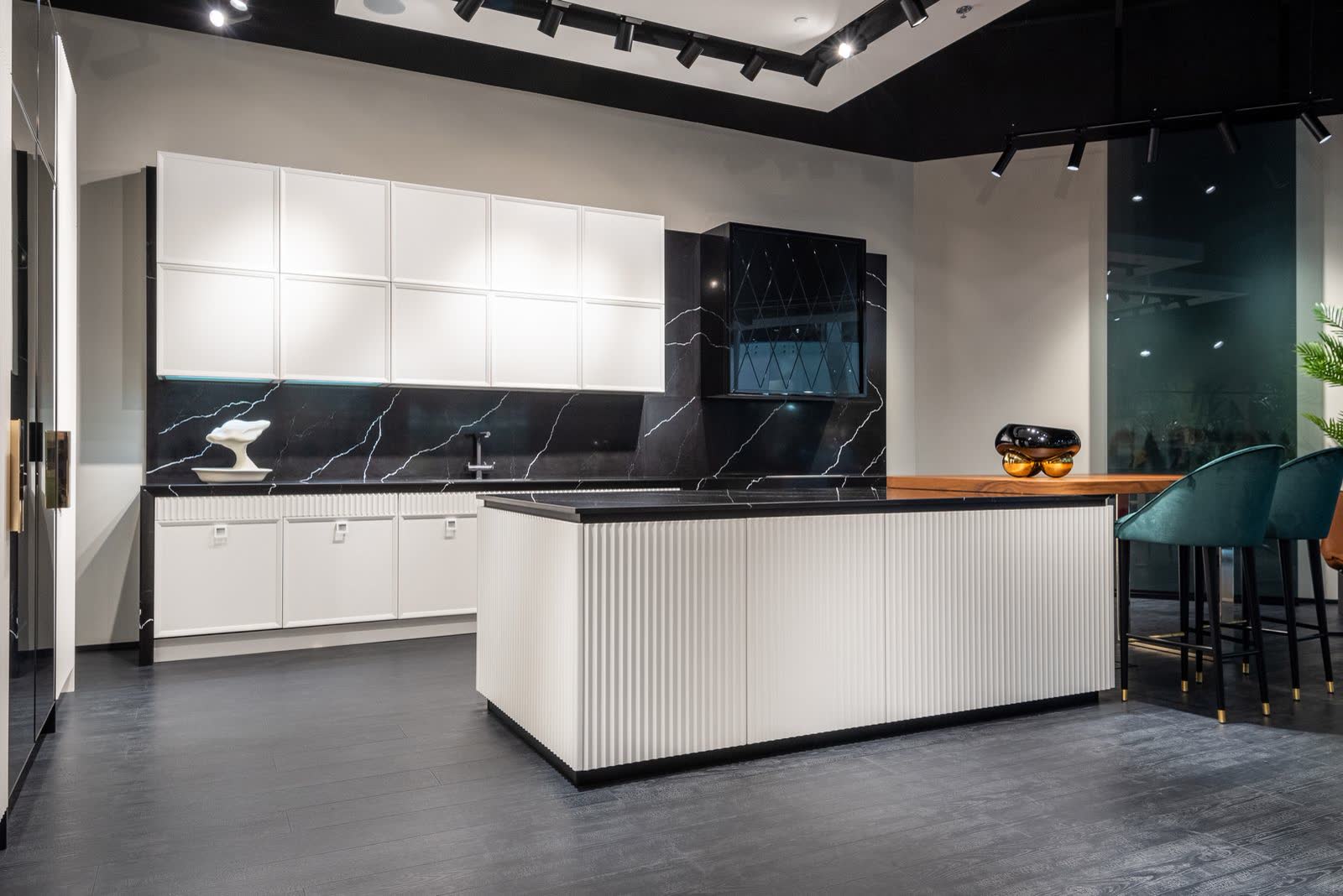 Kitchen with black stone island